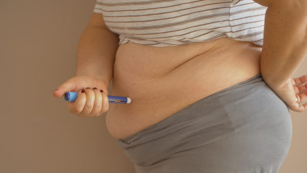 Overweight Diabetic Injecting Insulin